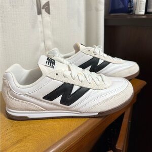 New Balance women’s White and Black Sneakers